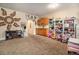 Bright and spacious playroom with ample storage, cozy carpeting, and playful decor for  at 10818 Cimarron St # 1202, Firestone, CO 80504