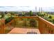 Backyard view from wooden deck looking over greenery and houses in the neighborhood at 6265 S Ider Way, Aurora, CO 80016