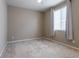Neutral, carpeted bedroom featuring a ceiling fan and a window with a view of the outdoors at 6265 S Ider Way, Aurora, CO 80016