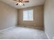 Bedroom with neutral walls, carpet, ceiling fan and window with natural light at 6265 S Ider Way, Aurora, CO 80016