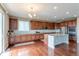 Modern kitchen with stainless steel appliances, granite countertops, and hardwood floors at 6265 S Ider Way, Aurora, CO 80016