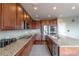 Beautiful kitchen featuring stainless steel appliances, an island, and sleek countertops at 6265 S Ider Way, Aurora, CO 80016