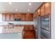 Well-equipped kitchen with stainless steel appliances, ample cabinetry, and granite countertops at 6265 S Ider Way, Aurora, CO 80016