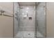 The luxurious tiled shower includes a bench seat and a rainfall showerhead at 6265 S Ider Way, Aurora, CO 80016