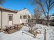 Backyard with shed, picnic table, and snowy ground at 5191 S Pennsylvania St, Littleton, CO 80121