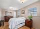 Main bedroom with hardwood floors and dresser at 5191 S Pennsylvania St, Littleton, CO 80121