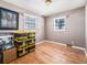 Empty bedroom featuring wood floors and a window at 5191 S Pennsylvania St, Littleton, CO 80121