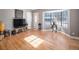 Living room with hardwood floors, bay window, and tv at 5191 S Pennsylvania St, Littleton, CO 80121