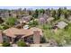 Aerial view of the home featuring a brick chimney and surrounding landscaping at 2837 Reed St, Wheat Ridge, CO 80033