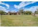 Expansive front yard with mature trees and landscaping at 2837 Reed St, Wheat Ridge, CO 80033