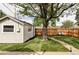 Landscaped backyard with a new wooden fence, offering privacy and charm for outdoor enjoyment at 3365 S Grant St, Englewood, CO 80113