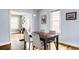 Bright dining area with hardwood floors and a dining table that seats four at 3365 S Grant St, Englewood, CO 80113