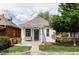Charming cottage-style home with a cozy front porch and well-maintained lawn at 3365 S Grant St, Englewood, CO 80113