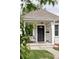 Inviting front porch with bench seating, perfect for enjoying the outdoors at 3365 S Grant St, Englewood, CO 80113