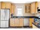 Well-equipped kitchen with stainless steel appliances, custom cabinetry, and a functional layout at 3365 S Grant St, Englewood, CO 80113