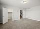 Neutral bedroom with carpet, paneled door to walk in closet, and paneled door to hallway at 4837 S Buchanan St, Aurora, CO 80016