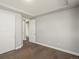 Bright bedroom with hardwood floors, closet, and doorway to another room at 4837 S Buchanan St, Aurora, CO 80016