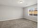 Neutral bedroom with carpet, a window, and white trim at 4837 S Buchanan St, Aurora, CO 80016