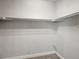 Walk-in closet with shelving and carpet flooring at 4837 S Buchanan St, Aurora, CO 80016