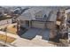 Well-kept two-story home with a three-car garage and neutral color palette in suburban neighborhood at 4837 S Buchanan St, Aurora, CO 80016