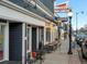 Charming restaurant exterior featuring sidewalk seating and decorative string lights at 4837 S Buchanan St, Aurora, CO 80016