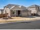 Attractive two-story home featuring a three-car garage, and professionally landscaped front yard at 4837 S Buchanan St, Aurora, CO 80016