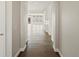 Bright hallway with hardwood floors, leading to a living area with plenty of natural light at 4837 S Buchanan St, Aurora, CO 80016