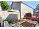 Landscaped backyard features patio, garden beds, and access to deck at 3853 S Genoa Ct # D, Aurora, CO 80013
