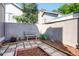 Private backyard with a bench and patio, perfect for relaxing outdoors at 3853 S Genoa Ct # D, Aurora, CO 80013