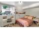 Bright bedroom with large window, desk, and comfortable sleeping area at 3853 S Genoa Ct # D, Aurora, CO 80013