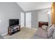 Relaxing room featuring neutral paint, comfortable day bed, and a small wet bar at 3853 S Genoa Ct # D, Aurora, CO 80013