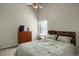 Bright bedroom featuring a queen size bed, natural light, and dark wood furniture at 3853 S Genoa Ct # D, Aurora, CO 80013