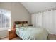 Inviting bedroom with natural light, a queen size bed, and adjacent nightstands at 3853 S Genoa Ct # D, Aurora, CO 80013