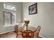 Cozy dining area with hardwood floors and a wooden table with seating for four at 3853 S Genoa Ct # D, Aurora, CO 80013