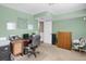 Well lit home office, with a functional desk, and extra storage at 3853 S Genoa Ct # D, Aurora, CO 80013
