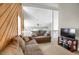 Open-concept living room with a vaulted ceiling and comfortable sofa seating at 3853 S Genoa Ct # D, Aurora, CO 80013