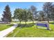 Scenic view of Sunrise Park with lush greenery and a walking path, perfect for outdoor enjoyment at 3853 S Genoa Ct # D, Aurora, CO 80013