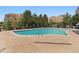 Community swimming pool with surrounding patio and building views at 9059 E Panorama Cir # B306, Englewood, CO 80112