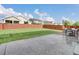 This backyard features a well-maintained lawn, a privacy fence and a patio with furniture, perfect for outdoor living at 16048 Elizabeth St, Thornton, CO 80602