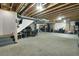Open basement space with carpet flooring, ideal for customizable living or entertainment area at 16048 Elizabeth St, Thornton, CO 80602
