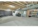 Unfinished basement with high ceilings, offering potential for customized living or ample storage at 16048 Elizabeth St, Thornton, CO 80602