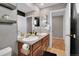 Bathroom featuring double sinks, mirrors, and vanity at 16048 Elizabeth St, Thornton, CO 80602