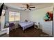 Bedroom features a neutral paint, plush carpet, and large windows at 16048 Elizabeth St, Thornton, CO 80602