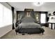 This bedroom features dark walls, carpet, large windows, a ceiling fan, and a full-sized bed with canopy at 16048 Elizabeth St, Thornton, CO 80602