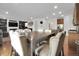 Open floor plan featuring a dining area that flows into the living room and kitchen at 16048 Elizabeth St, Thornton, CO 80602