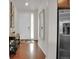 Welcoming entryway with hardwood floors and a view of the front door at 16048 Elizabeth St, Thornton, CO 80602