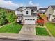 Well-manicured lawn and mature trees adorn this beautiful home with a two-car garage at 16048 Elizabeth St, Thornton, CO 80602