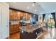 Stylish kitchen featuring wood cabinets, granite countertops, stainless steel appliances, and breakfast nook at 16048 Elizabeth St, Thornton, CO 80602