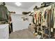 Spacious walk-in closet with built-in shelving and ample storage for clothes and accessories at 16048 Elizabeth St, Thornton, CO 80602