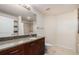 Updated bathroom with tile floors, wood cabinets and granite countertop at 1700 Bassett St # 802, Denver, CO 80202